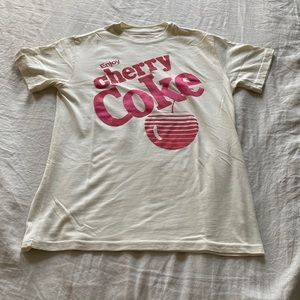 A Coca Cola t-shirt in size small-medium